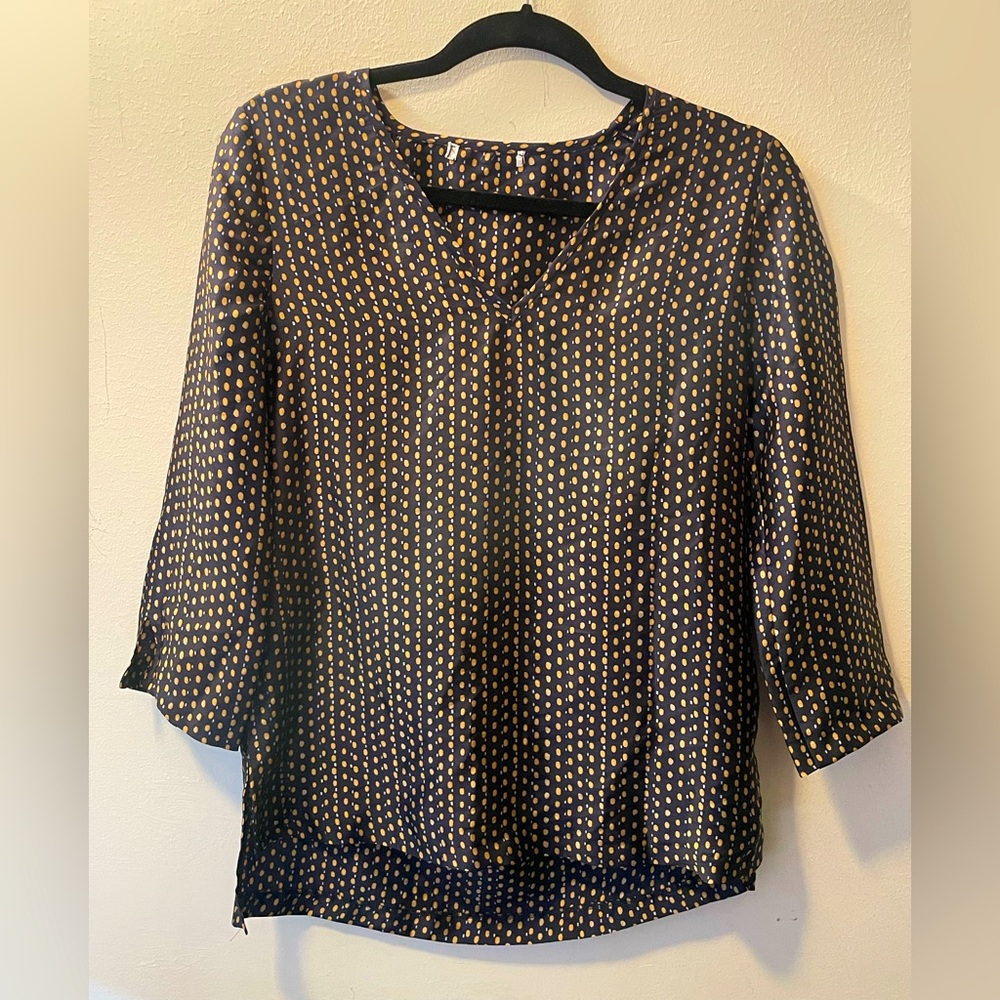 Sophisticated blouse with a silk-like texture.